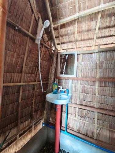 a bathroom with a sink and a shower at EL-NARA SEASIDE Beach Resort in El Nido