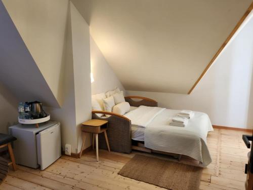 a bedroom with a large bed in a attic at Uroczysko pod Babią Górą in Zawoja