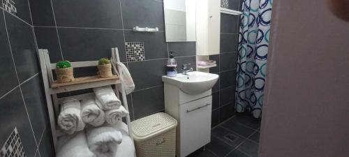 a small bathroom with a sink and a toilet at Skalia Mountain Sea Serenity in Kalymnos