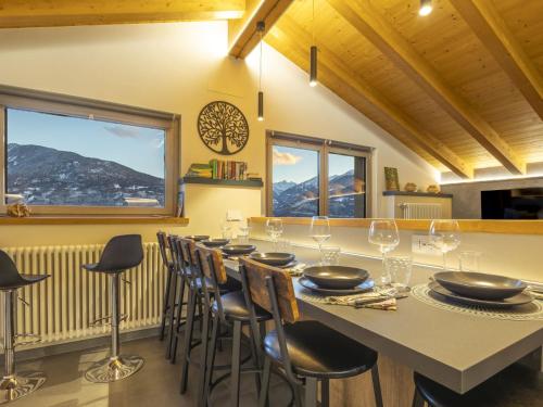 a dining room with a long table and chairs at Villa Cech Coast House by Interhome in Civo