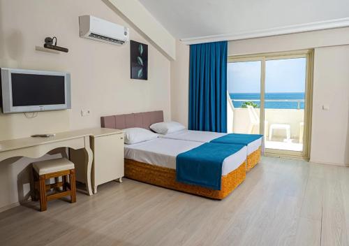 Postel nebo postele na pokoji v ubytování Valeri Beach Hotel - All Inclusive