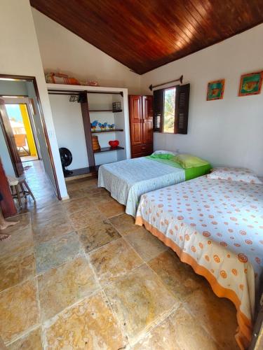 a bedroom with two beds in a room at Nascimento BEACH in Águas Belas