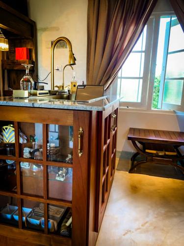 a kitchen with a sink and a counter top at Galkanda Walawwa Boutique Villa in Kandy