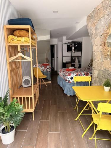 a room with a bunk bed and a bedroom at Art Apartments Leiria Historic House in Leiria