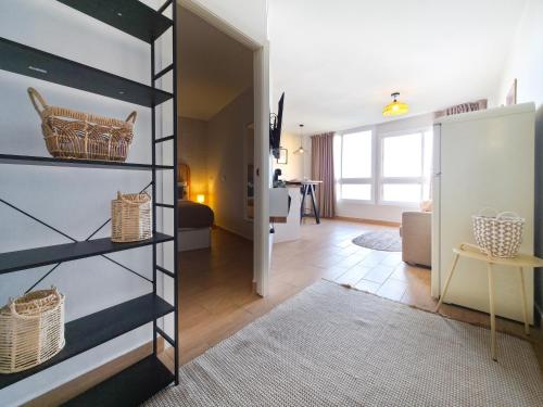 a living room with a shelf with baskets on it at Verana House in Arguineguín