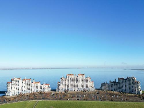 a group of apartment buildings next to the water at Hello Zeeland - Port Scaldis 11-031 in Breskens