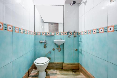 a bathroom with a toilet and a sink at Hotel New Royal Just Near Old Delhi Railway Station And Red Fort in New Delhi