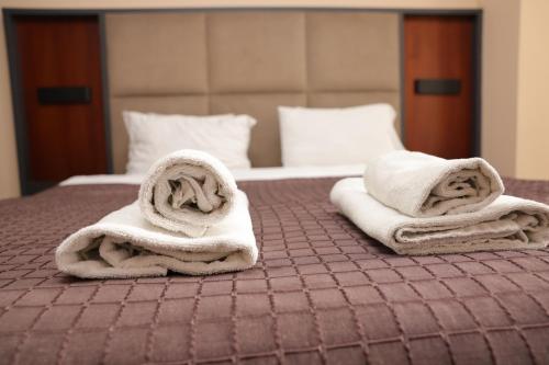 Llit o llits en una habitació de Hotel Oferta