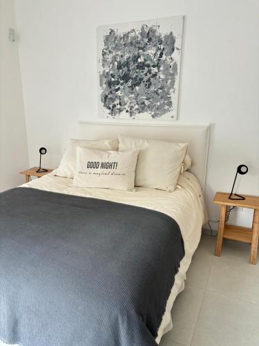 a bedroom with a bed with a sign on it at Nuestro Lugar Soñado in Concepción del Uruguay