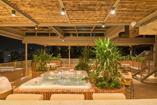 a jacuzzi tub in the middle of a building at Hotel Dix in Medellín