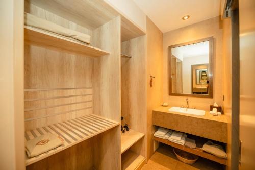 a bathroom with a sink and a mirror at Saska Boutique Hotel in Cusco