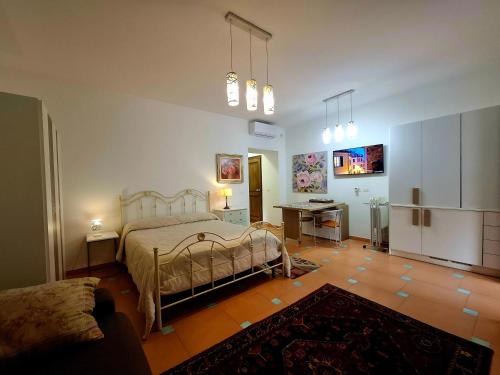 a bedroom with a bed and a table in it at Villa Margot in Agropoli
