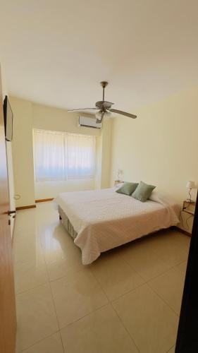 a bedroom with a bed and a ceiling fan at Mimi’s dream Luján in Luján