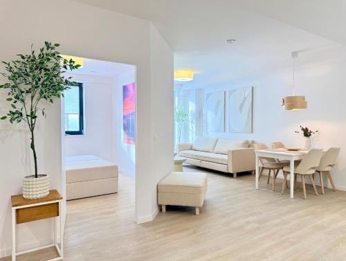 a living room with a couch and a table at Apartamenty Polna Park in Duszniki Zdrój