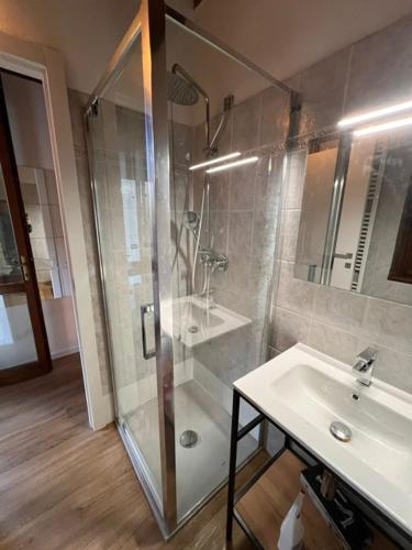 a bathroom with a shower and a sink at Villa Gaia Apartments pool wifi parking in Malcesine