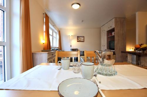 a kitchen with a table with a plate on it at Appartement 107 in Juist