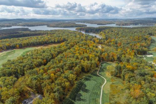 an aerial view of a golf course and a river at Bourbon Sunset by Railey Vacations in Swanton