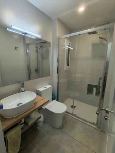 a bathroom with a sink and a toilet and a shower at BARCELONA AIRPORT Mi COLIBRÍ in El Prat de Llobregat