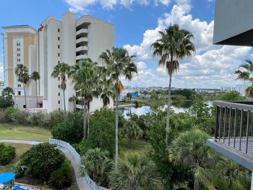 a view from the balcony of a building with palm trees at 15 - Amazing Vulcano Bay - Universal View in Orlando