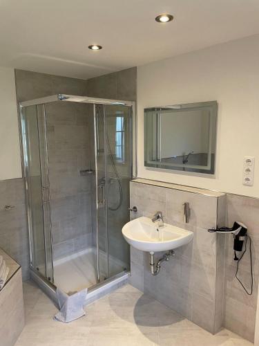 a bathroom with a shower and a sink at Seaside-Amrum-5 in Norddorf