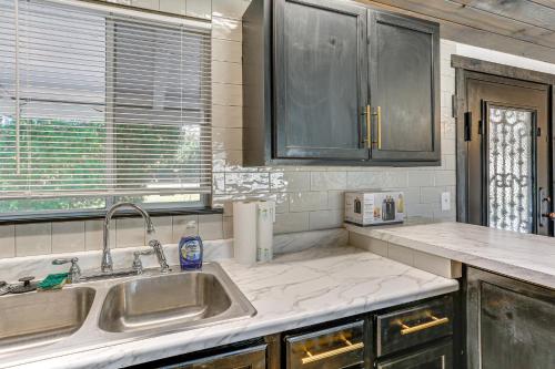a kitchen with a sink and a counter top at 1 Mi to Main St Eats! Single-Level Red Bluff Home in Red Bluff