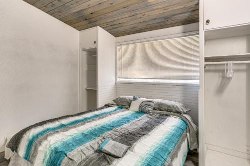 a bedroom with a bed and a window at 1 Mi to Main St Eats! Single-Level Red Bluff Home in Red Bluff