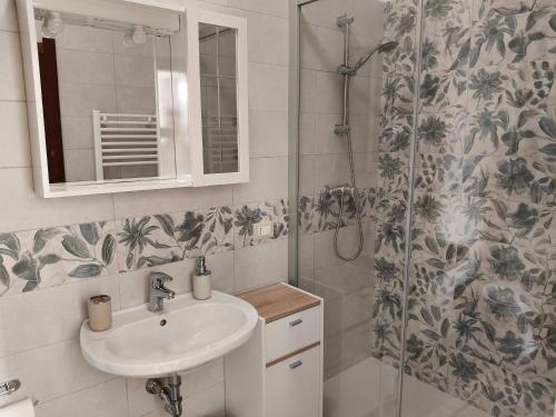 a bathroom with a sink and a shower at B&B SunBeach in San Benedetto del Tronto