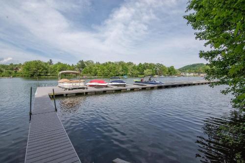 a dock with boats parked on the water at Lake & Lift by Railey Vacations in McHenry