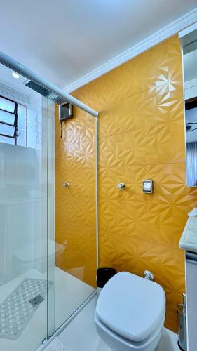 a bathroom with a glass shower and a toilet at 3D apartment, central - prox UFN in Santa Maria