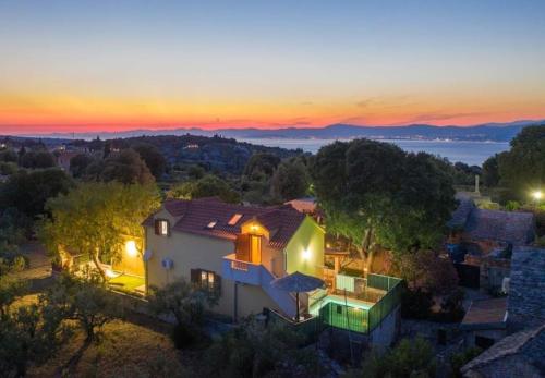 an aerial view of a house at sunset at House Niksi in Škrip