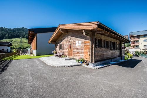 a small wooden building with a roof at Samerhäusl in Bruck an der Großglocknerstraße