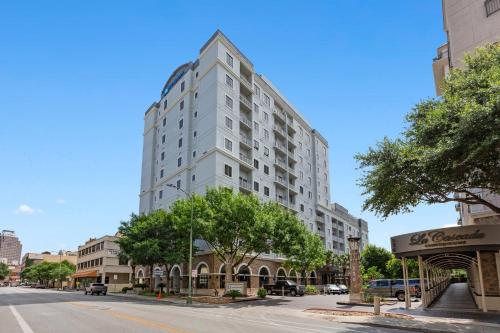 a tall white building on a city street at Club Wyndham La Cascada in San Antonio