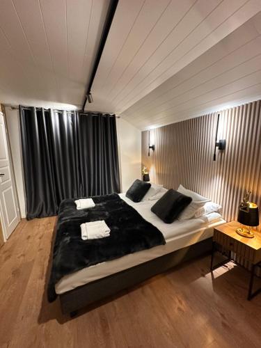 a bedroom with a large bed in a room at Northern lights Ivalo Stay in Ivalo