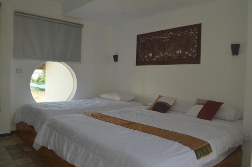 Llit o llits en una habitació de Ruda Mini Hotel