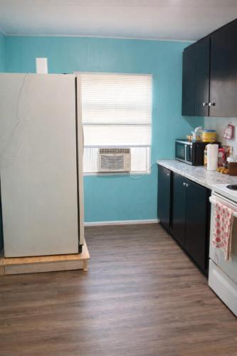 a kitchen with a white refrigerator in a room at GpL 424 San Bernardino in North Fort Myers