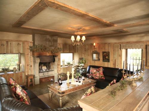 a living room with a couch and a table at Vielsalm Stay with furry friends in Vielsalm