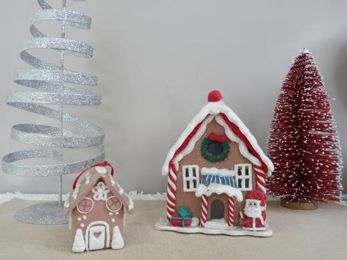 a group of gingerbread houses and a christmas tree at The Cosy Beach Nook 2BR Near Airport & Beach in Sydney