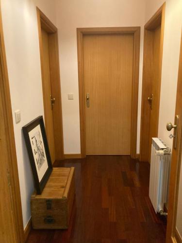 a hallway with a room with a door and a box at Residência Albuquerque in Santa Maria Da Feira
