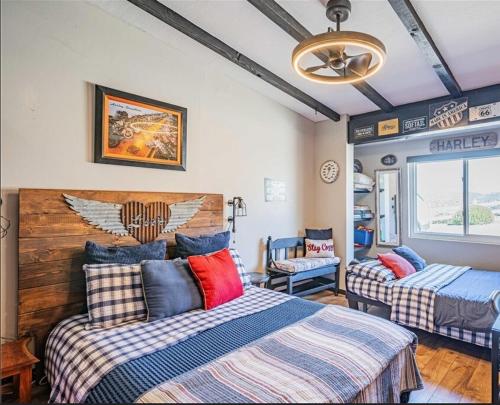 a bedroom with two beds and a ceiling fan at Panoramic view in San Marcos