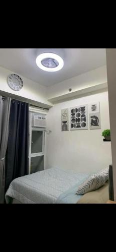 a bedroom with a bed in a room at Essel s Comfy Place in Manila
