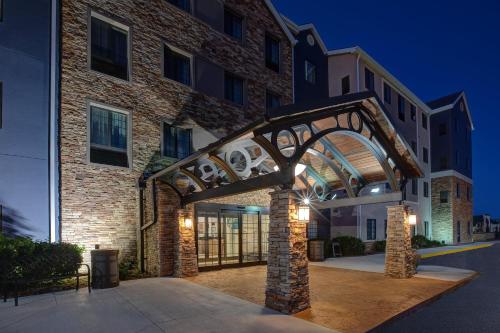 a building with an archway in front of it at Staybridge Suites Lincoln North East by IHG in Lincoln