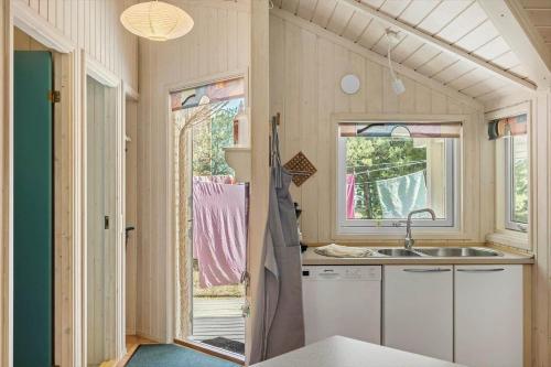 a kitchen with a sink and a window at 1445 Aakirkeby - Poserekrogen 13 in Vester Sømarken