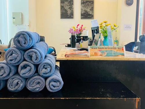 a pile of blue towels stacked on a table at Baramee Resortel in Patong Beach