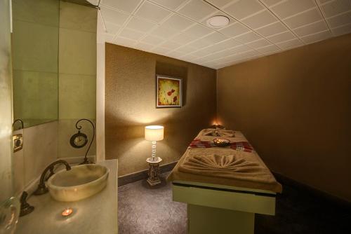 a bathroom with a sink and a bath tub at White Monarch Hotel in Istanbul
