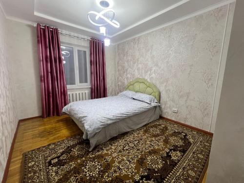 Квартира tesisinde bir odada yatak veya yataklar