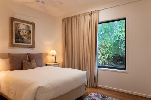 a bedroom with a bed and a large window at Balmoral 575 in Montville