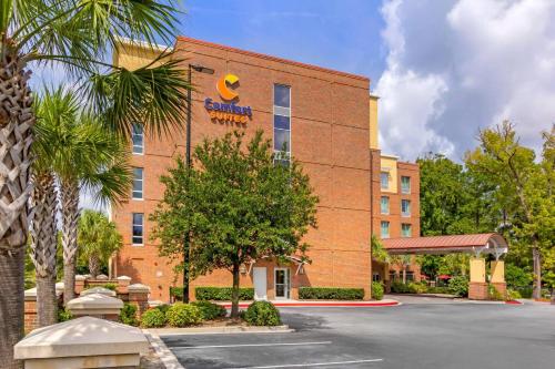 a hotel with a sign on the side of a building at Comfort Suites Charleston West Ashley in Charleston