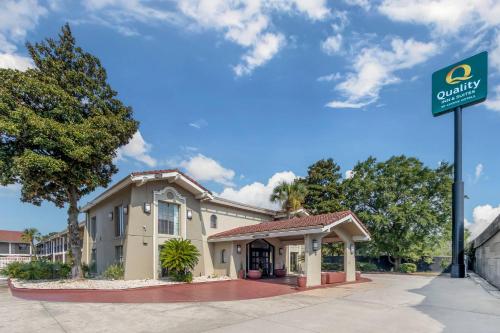 a building with a sign in front of it at Quality Inn & Suites North Charleston - Ashley Phosphate in Charleston