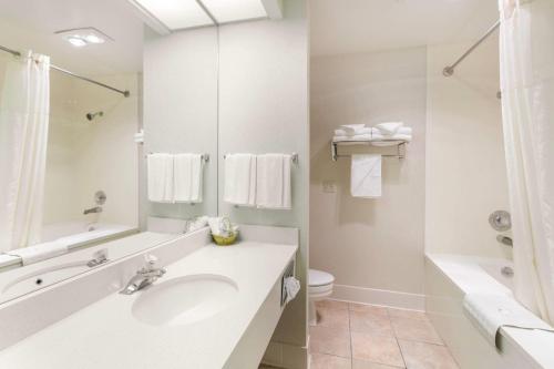 a white bathroom with a sink and a toilet at Quality Inn Payson I-15 in Payson