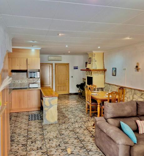a living room with a couch and a table at Casa Caloret - Playa y centro a 2 min in Vinarós